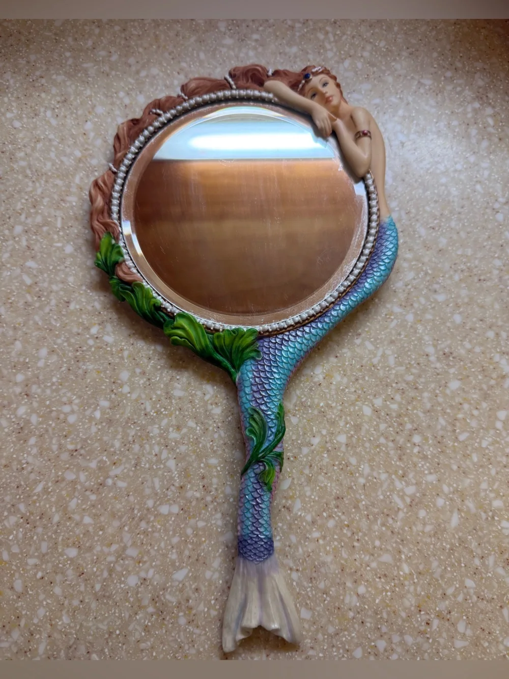 Mermaid Scale Hand Mirror with Green Leaf Accents
